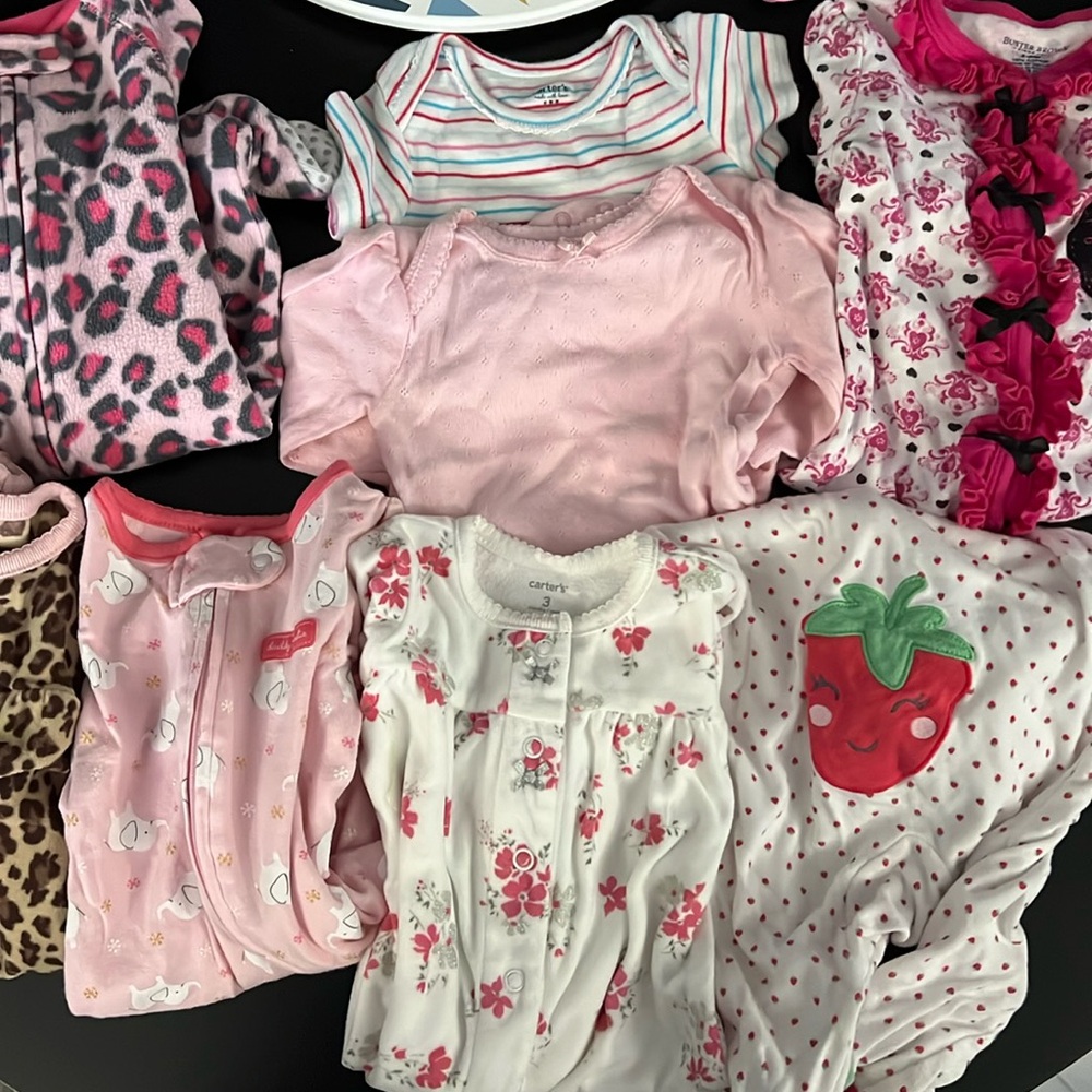 Lot of Girl Onesies and Sleepwear sizes range from 0-6 months